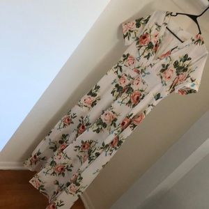 White floral maxi dress with slit and beading.